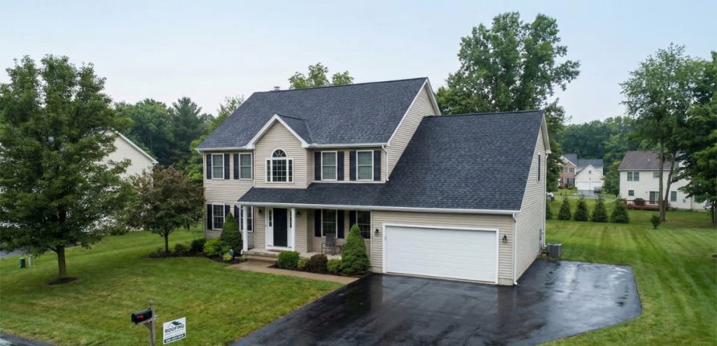 House with a dark shingle roof.